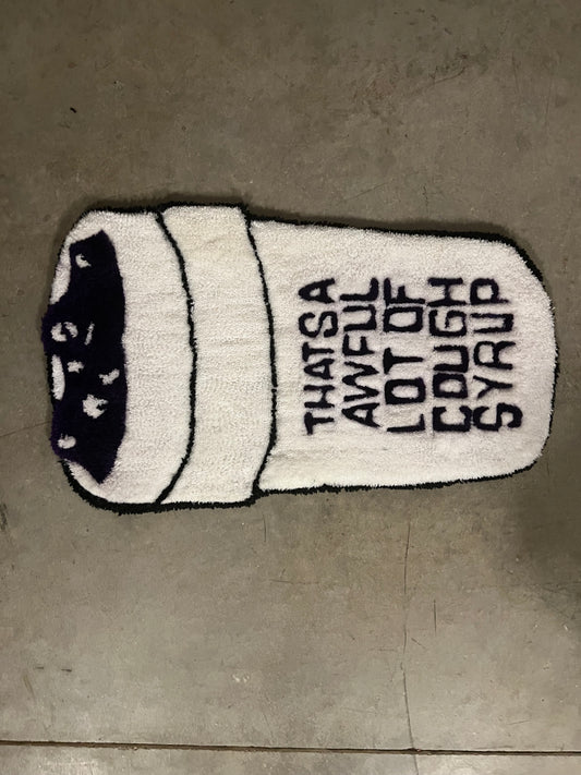 "AWFUL LOT OF COUGH SYRUP" CUP RUG